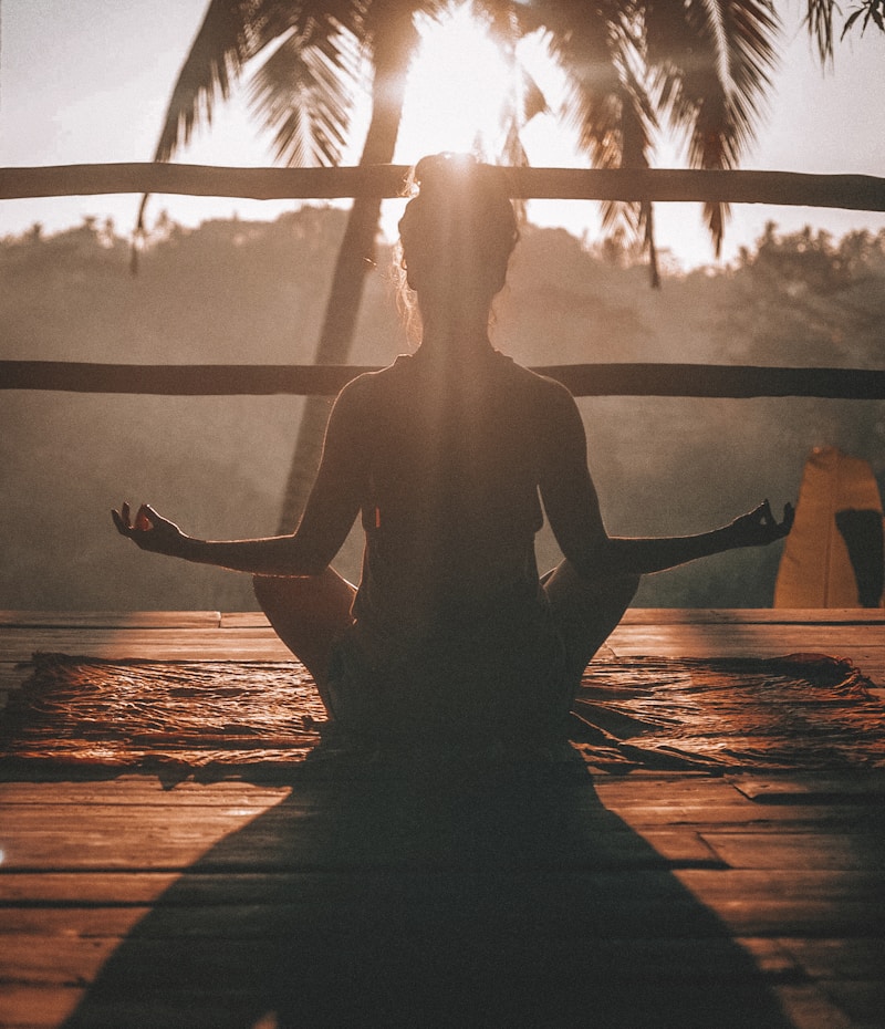 Person in peaceful natural setting, representing hope and renewal